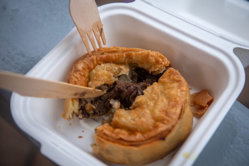 Close-up of the meat inside the steak and gravy pie.