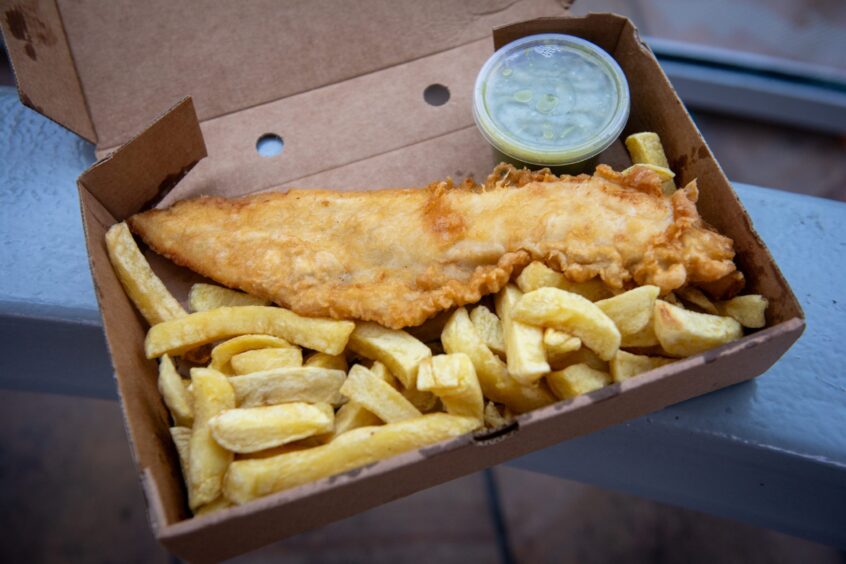 Medium haddock with chips and a tub of mushy peas from Zanres in Peterhead.