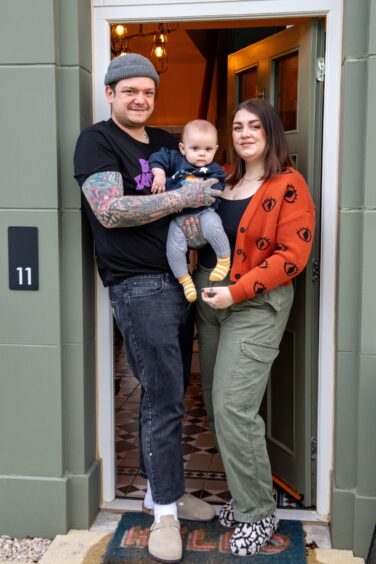 Aberdeenshire couple Hannah and Chris Hadden at the entrance of their new build home in Chapelton, with their son Sully.