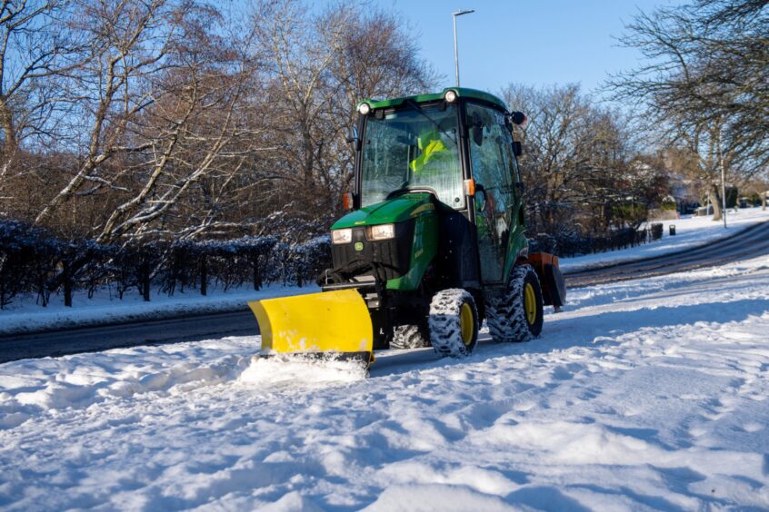 Tractor being used to clear snow in Aberdeen
