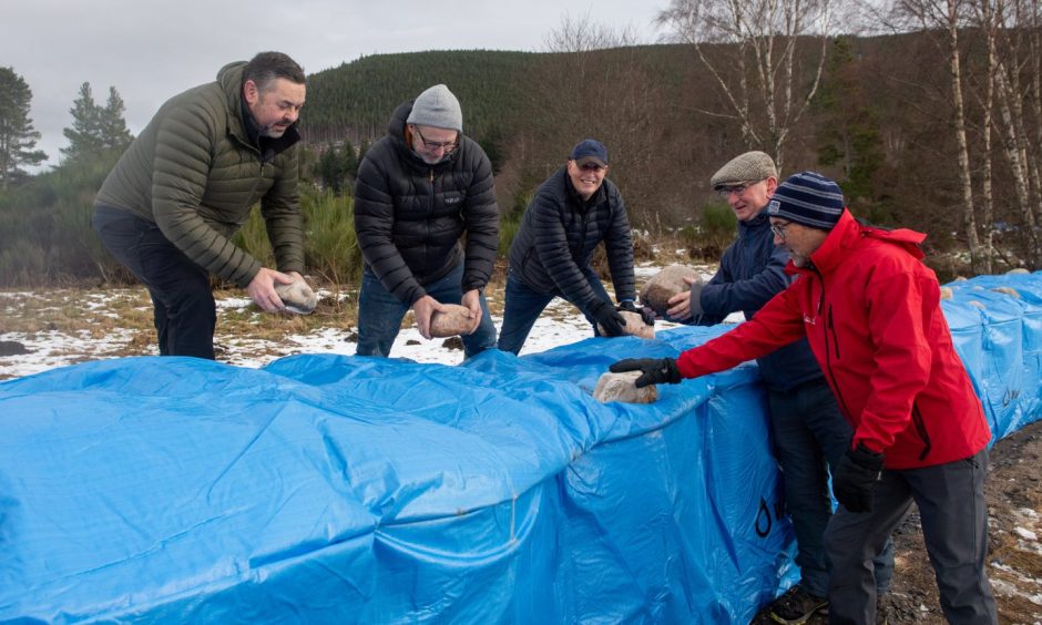Volunteers working on the Ballater flood defence