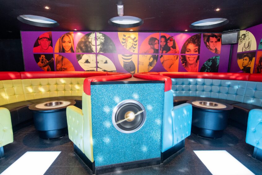 The colourful booths Aura nightclub