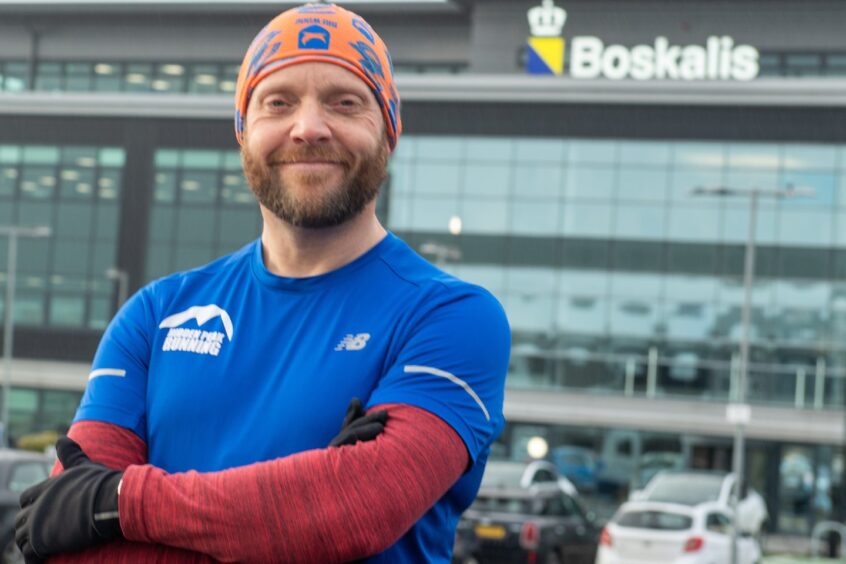 Bob Crowe looks at the camera in his running gear outside the Boskalis office in Westhill