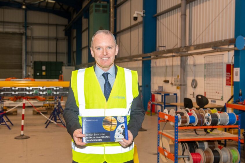 Mr Gillespie with a copy of the new strategy document. 