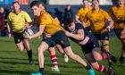 Gordonians No10 Josh Andrew on the charge against Aberdeen Grammar. Image: Kami Thomson/DC Thomson