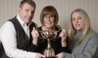 Bill's widow Bet McAllister (centre) with son Ker and daughter Gemma and the new trophy Image Ewen Weatherspoon.
