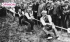 Former UK prime minister James Ramsay MacDonald, pictured here at the front of the rope during a party rally tug of war in 1923. Image: Granger/Shutterstock