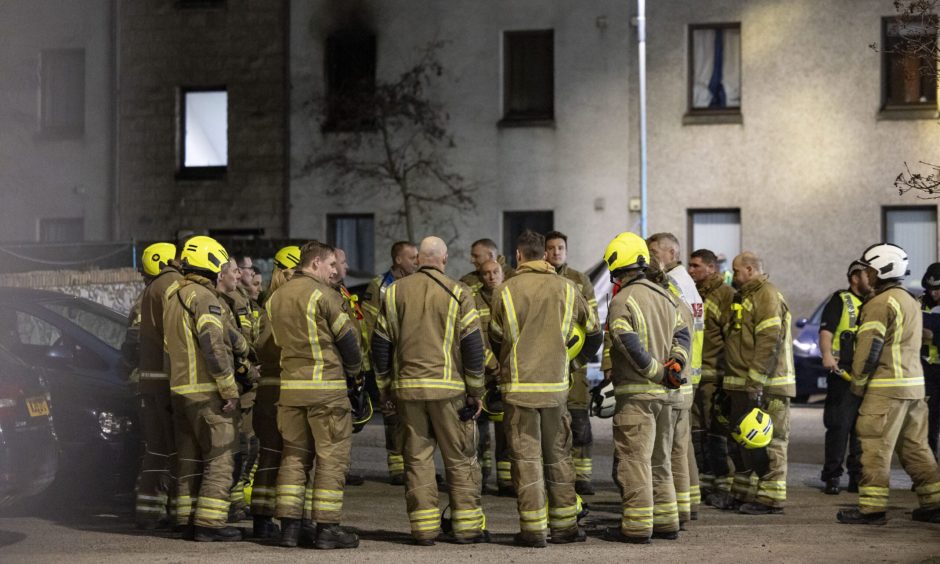 Firefighters outside block of flats on Back Hilton Road.