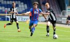 Harry Hennem, centre during his time with Inverness Caley Thistle, has joined Nairn County.