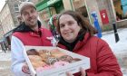 Kelly Anderson, from Fort William, with her free dozen doughnuts after waiting for 10 hours outside before the opening of the Inverness Krispy Kreme shop. Sandy McCook/DC Thomson