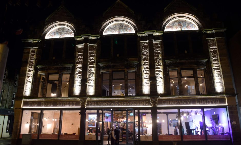 The Rose Street Foundry Bar lit up at night