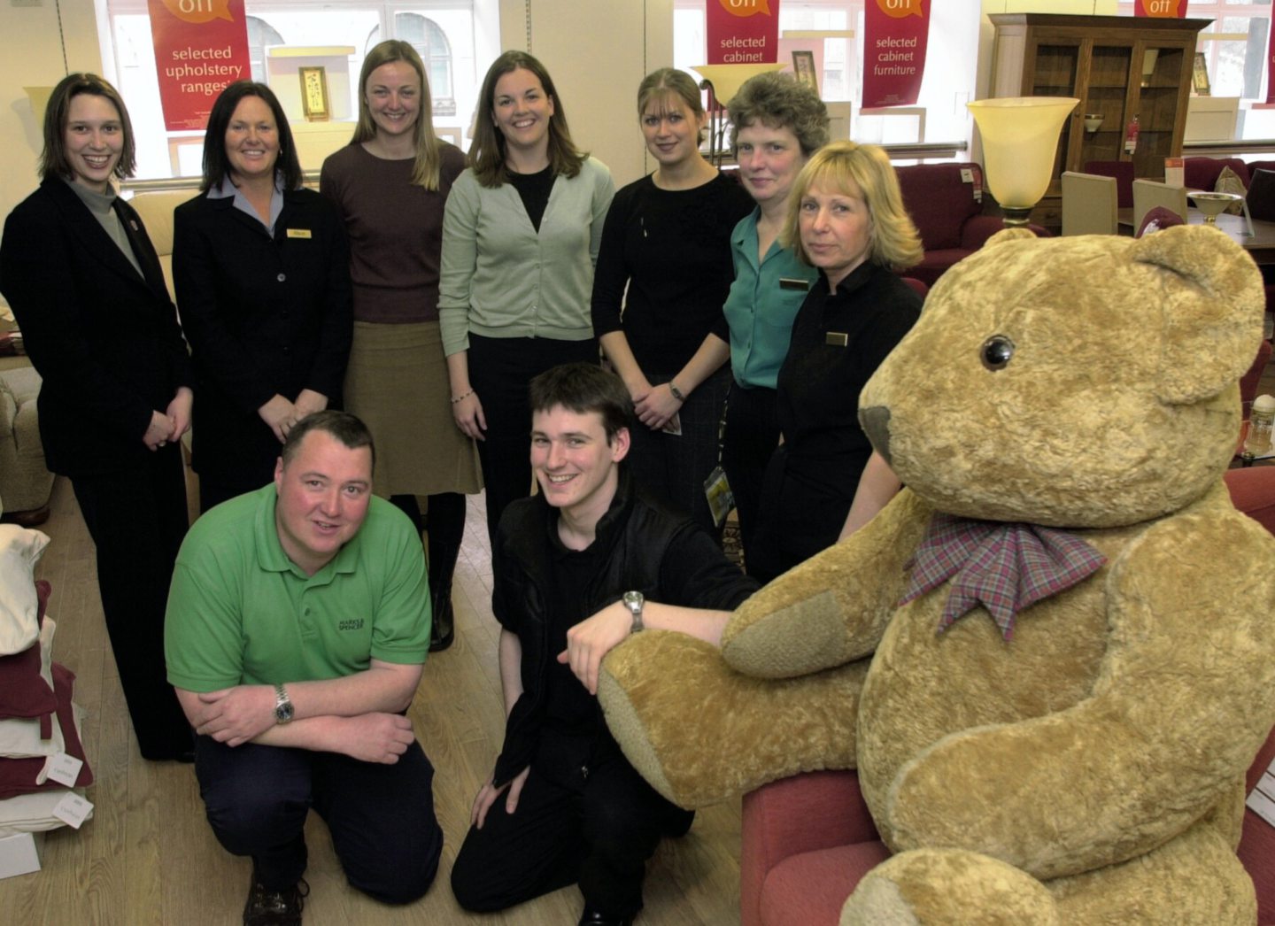 Marks and Spencer staff with a giant teddy bear