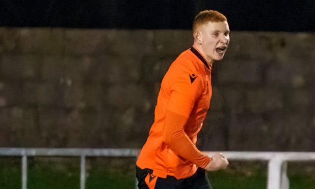 Jordan MacRae celebrates scoring for Brora Rangers against Pollok in the Scottish Cup