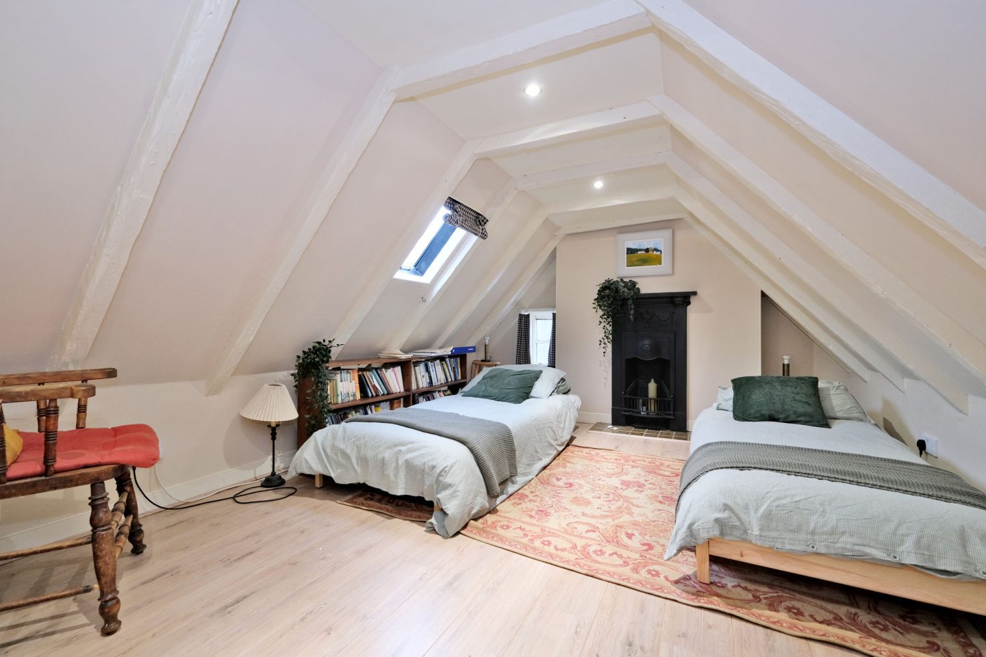 Another bedroom inside the Aberdeen property, featuring sloped ceilings.