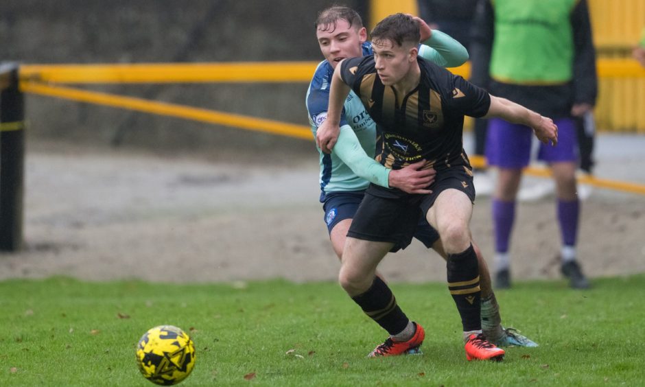 Defender Lyall Booth, right, in action for Huntly against Forfar Athletic in the Scottish Cup this season.