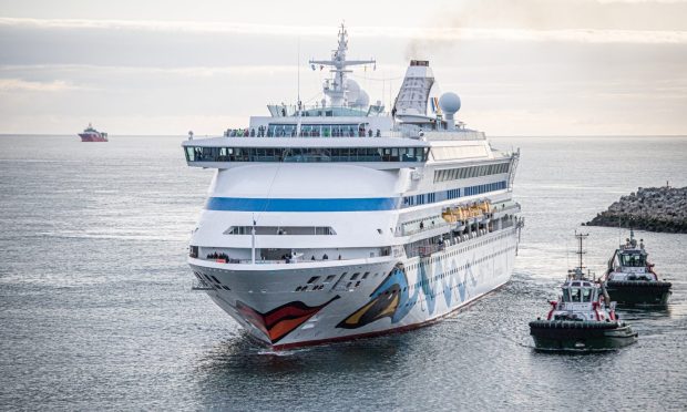 Large cruise ship entering Aberdeen harbour.