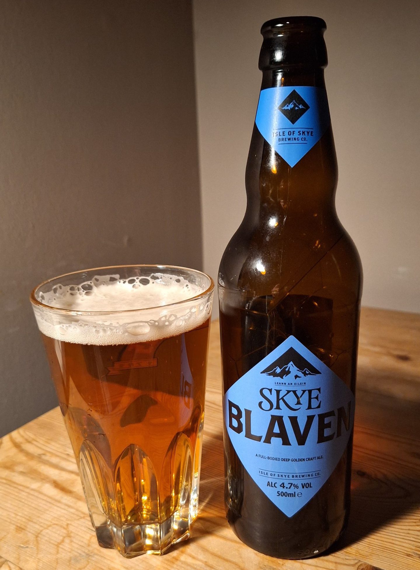 A bottle of Isle of Skye Brewing Company's Blaven beer poured out into a glass. 