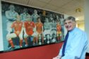 Former Aberdeen captain Ally Shewan, pictured in 2009, looking at the mural of Dons captains, on which he appears.
Image: Chris Sumner/DC Thomson.       .