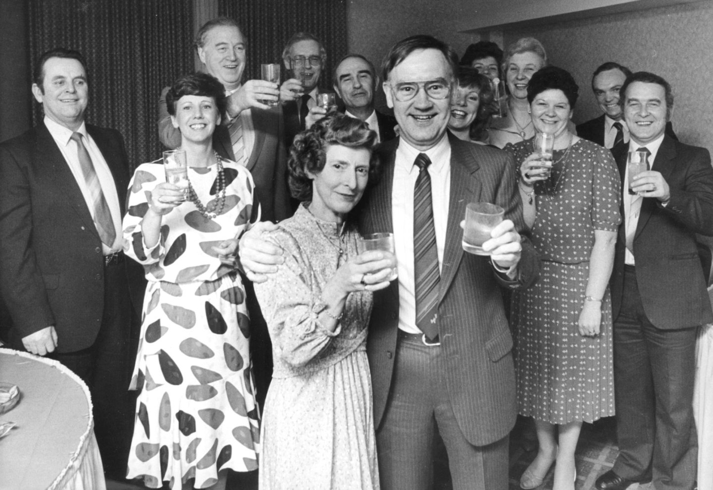 Marks and Spencer warehouse manager Douglas Melvin and his wife Rose making a toast with others behind them
