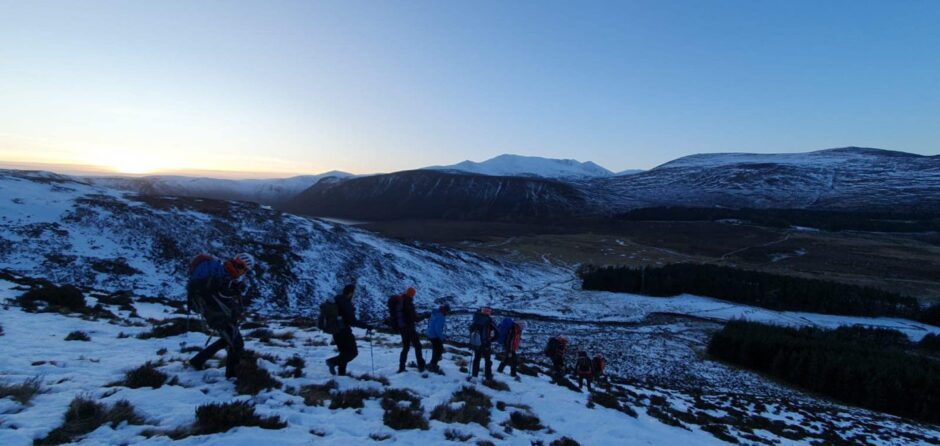  Braemar Mountain Rescue Team lead hikers down the icy slopes around Loch Muick.