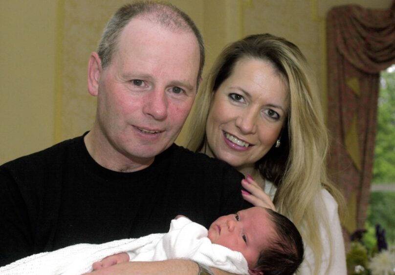 Stewart Milne with his partner Joanna Robertson and their new born baby boy Jamie in 2002.