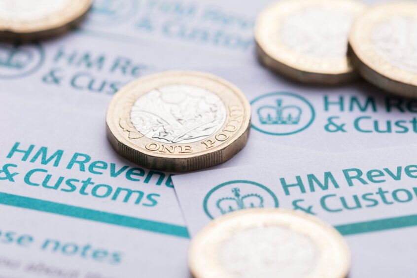 HM Revenue and Customs form with coins