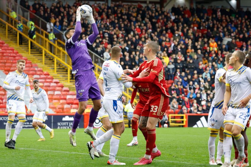 St Johnstone goalkeeper Dimitar Mitov catches the ball in a Premiership match between Aberdeen and St Johnstone