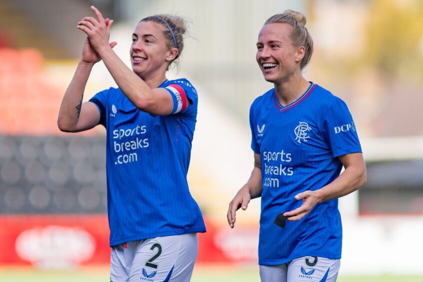 Rangers captain Nicola Docherty, left, and Rachel McLauchlan, right, after a SWPL match against Celtic.