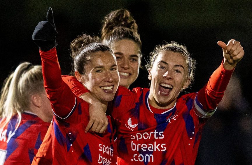 Rangers forward Jane Ross, left, and captain Nicola Docherty, right, celebrate after a SWPL win which cemented their place at the top of the table