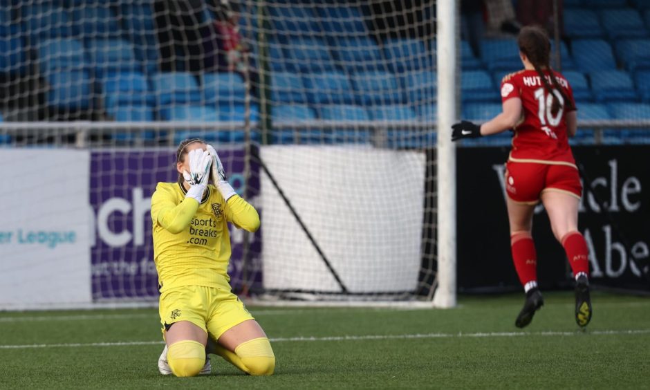 Rangers goalkeeper Jenna Fife has her head in her hands after her mistake saw Bayley Hutchison get a goal back for Aberdeen in the SWPL encounter.