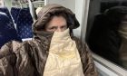 Martin Douglas reached for his wife's sleeping back to keep his temperature up on the train.