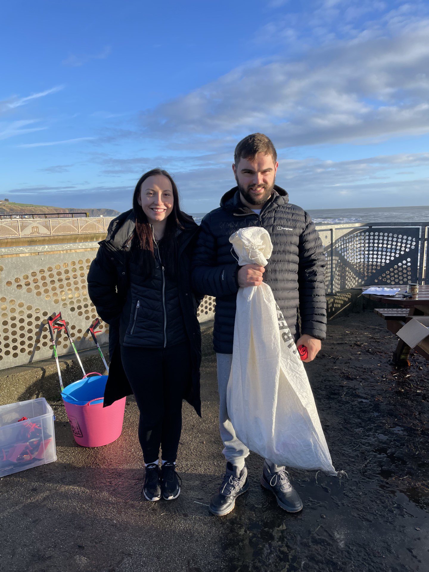 Two volunteers at Paws on Plastic's monthly beach clean in Stonehaven. 