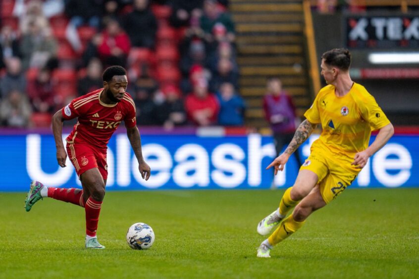 Shayden Morris of Aberdeen controls the ball against Bonnyrigg Rose. Image: Shutterstock.