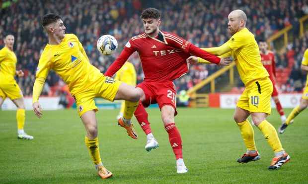 Dante Polvara (21) of Aberdeen and Lee Currie (10) of Bonnyrigg Rose during the sides' Scottish Cup clash. Image: Shutterstock.