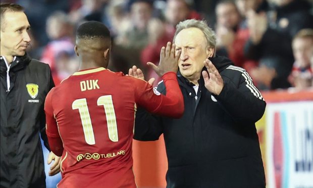 Luis 'Duk' Lopes with Aberdeen interim manager Neil Warnock. Image: Shutterstock.