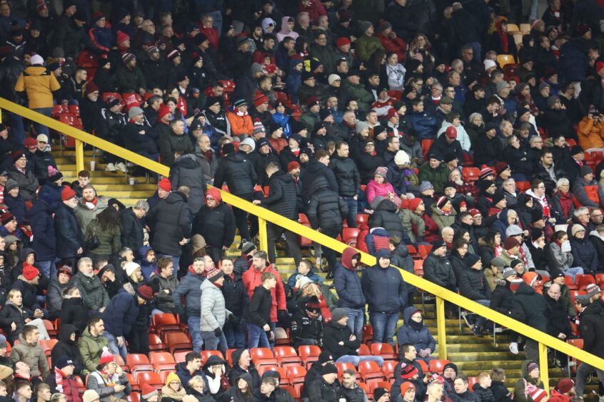 Aberdeen fans leave after St Johnstone score their second goal.