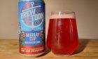 Brew Toon's version of Moray Cup beer poured into a glass next to its can