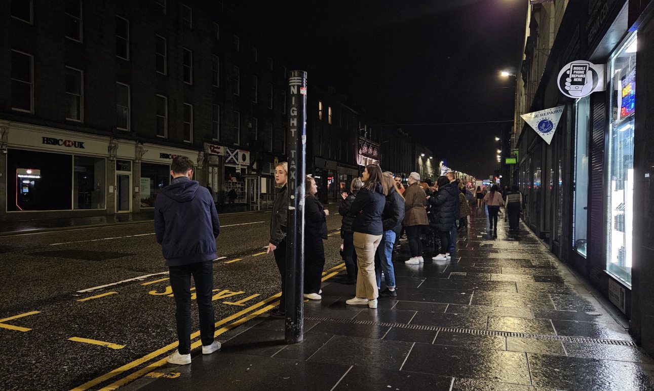 Queues of people waiting for taxis on Aberdeen's Union Street in February.