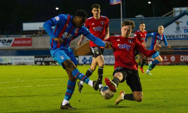 Caley Thistle's on-loan forward from Luton Town, Aribim Pepple, goes for goal against Queen's Park.