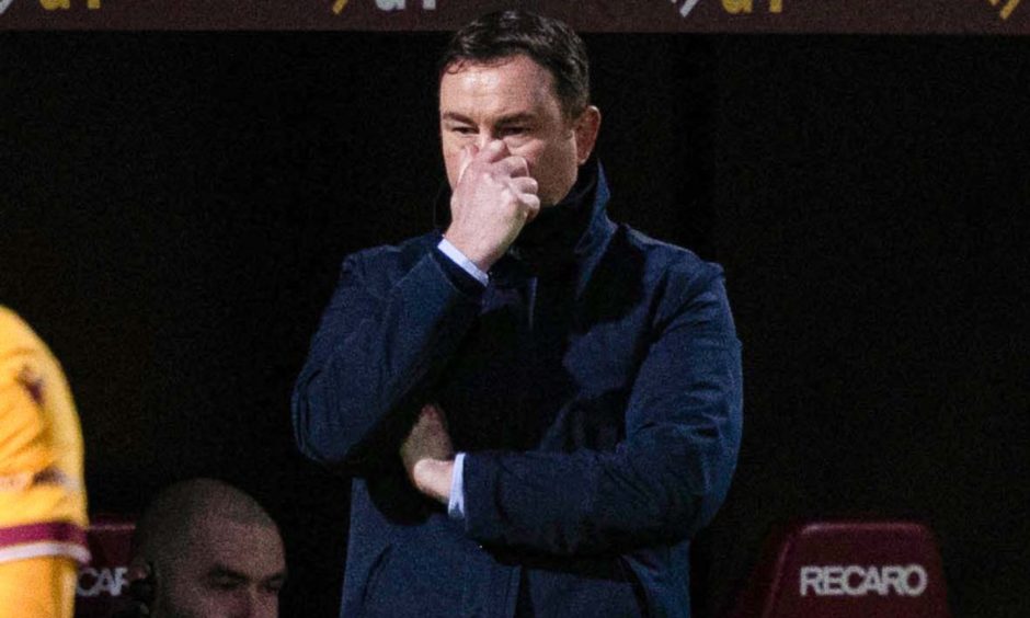 Ross County boss Derek Adams watches on as his team crash to a 5-0 loss at Motherwell on Tuesday night. Image: SNS.