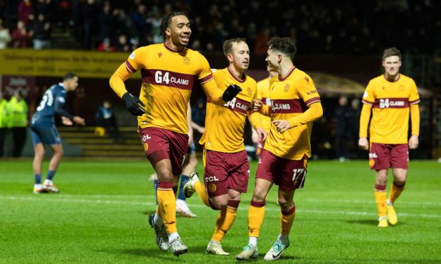 Motherwell's Theo Bair (left) celebrates after scoring a penalty to make it 3-0 with team-mates Harry Paton (centre) and Davor Zdravkovski. Images: Craig Foy/SNS Group
