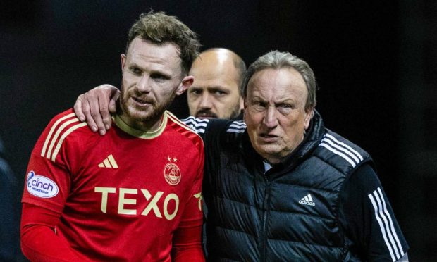 Neil Warnock speaks to Aberdeen's Nicky Devlin during the 2-1 loss at Rangers. Image: SNS
