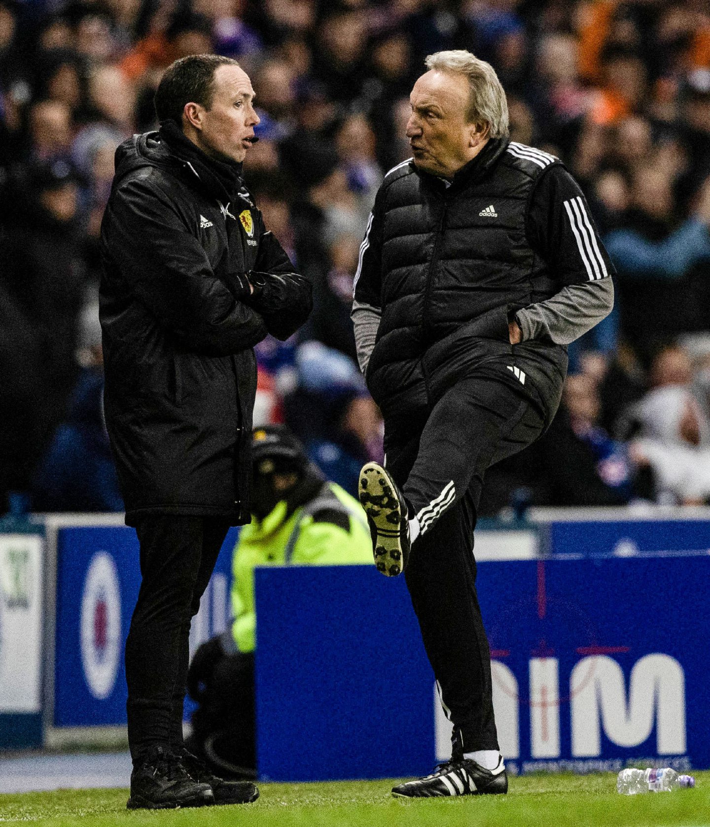 Aberdeen Interim manager Neil Warnock complains to the fourth official during the 2-1 loss to Rangers at Ibrox. Image: SNS 