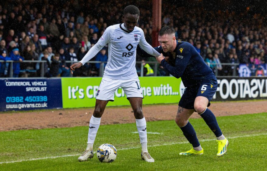 Victor Loturi in action for Ross County against Dundee.