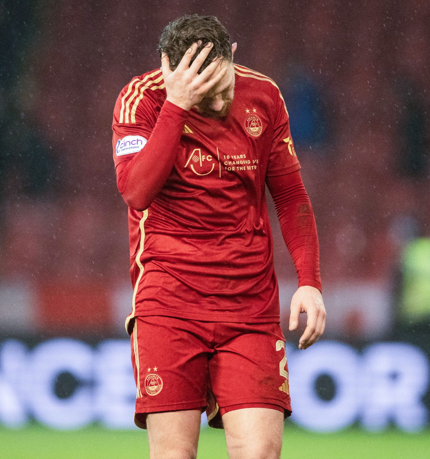 Aberdeen's Nicky Devlin looks dejected at full time after drawing 2-2 with Hibs.