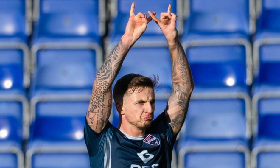 Ross County's Eamonn Brophy celebrates scoring to make it 2-0 against Livingston at the Global Energy Stadium. Image: SNS.