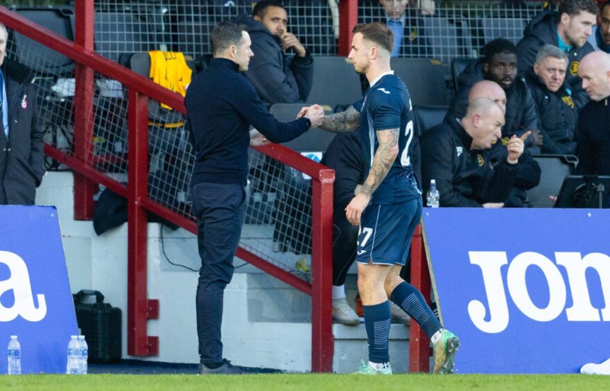 Ross County's Eamonn Brophy shakes hands with interim manager Don Cowie. Image: SNS.