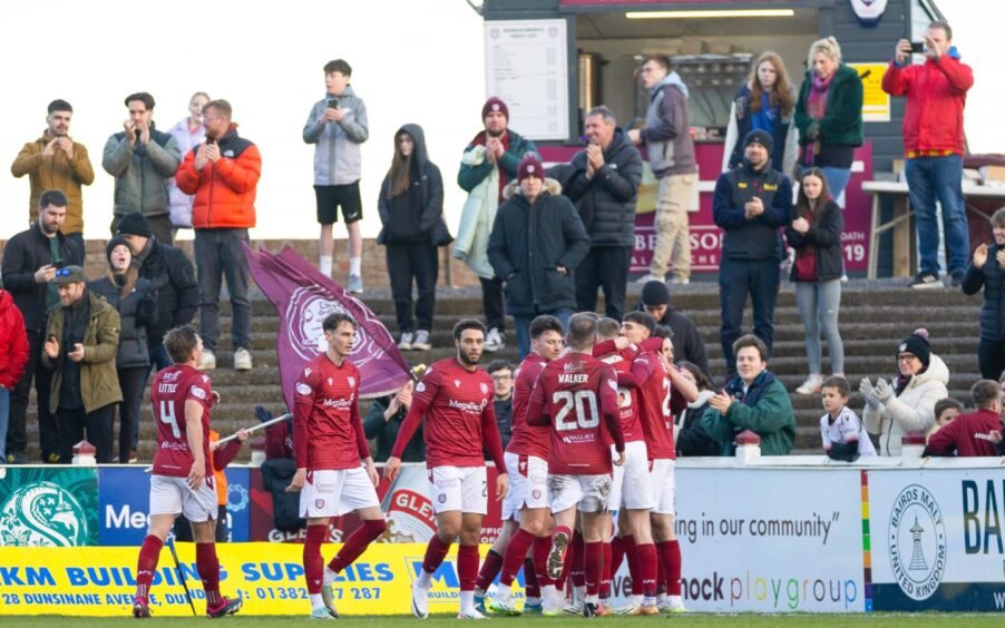 Arbroath celebrate Adam MacKinnon's opener against Caley Thistle in a Championship match at Gayfield.