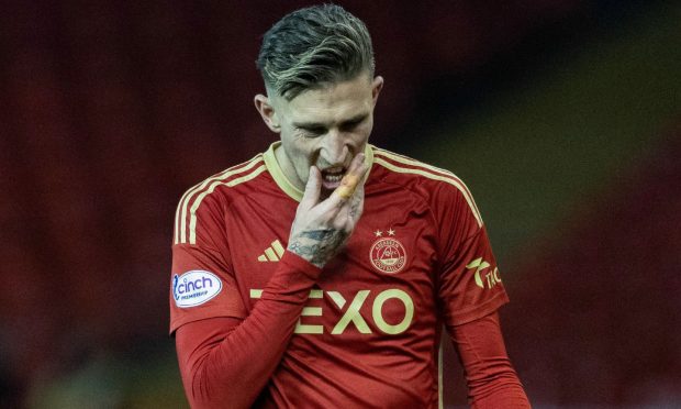 Aberdeen's Angus MacDonald was dejected after the 2-0 defeat to St Johnstone. Image: SNS.