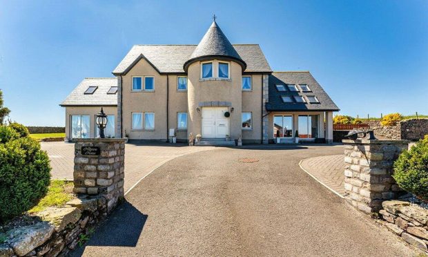 outside Hillview House, the Mearns home with an indoor pool.